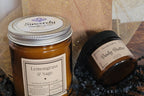 Two jars of 'Sincerely Candles & Co' products, a candle and body butter, with decorative ribbons.