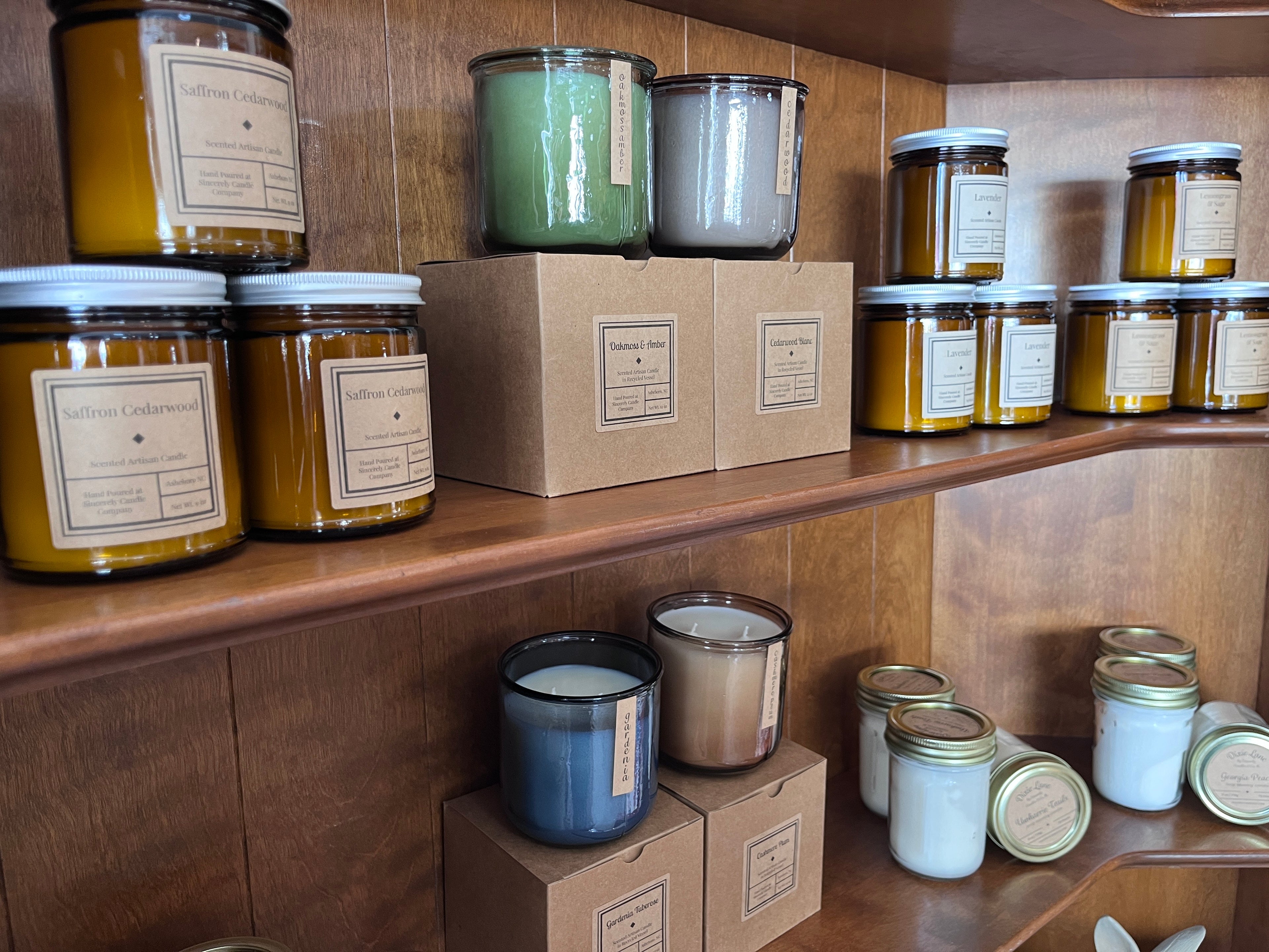 variety of candles on shelves