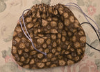 Brown patterned fabric on a floral background