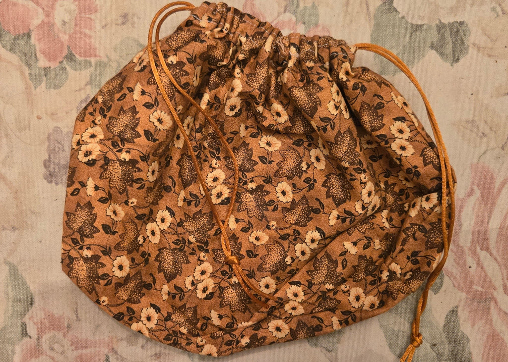 Decorative bag with floral pattern on a floral fabric background
